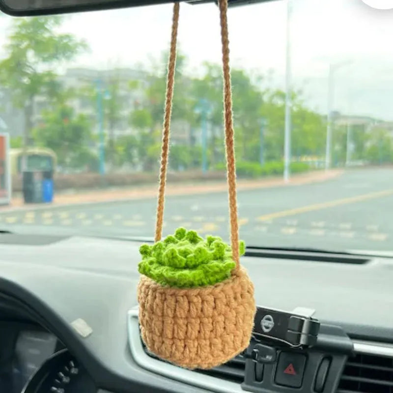 Green and white knitted wool plant ornament for car dashboard with hanging cord