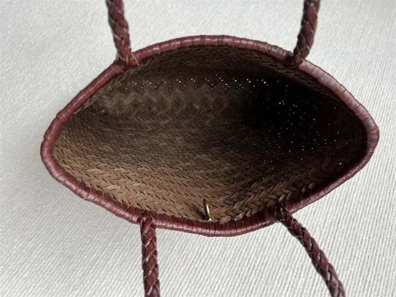 Brown woven genuine cowhide leather tote bag with a front pocket.