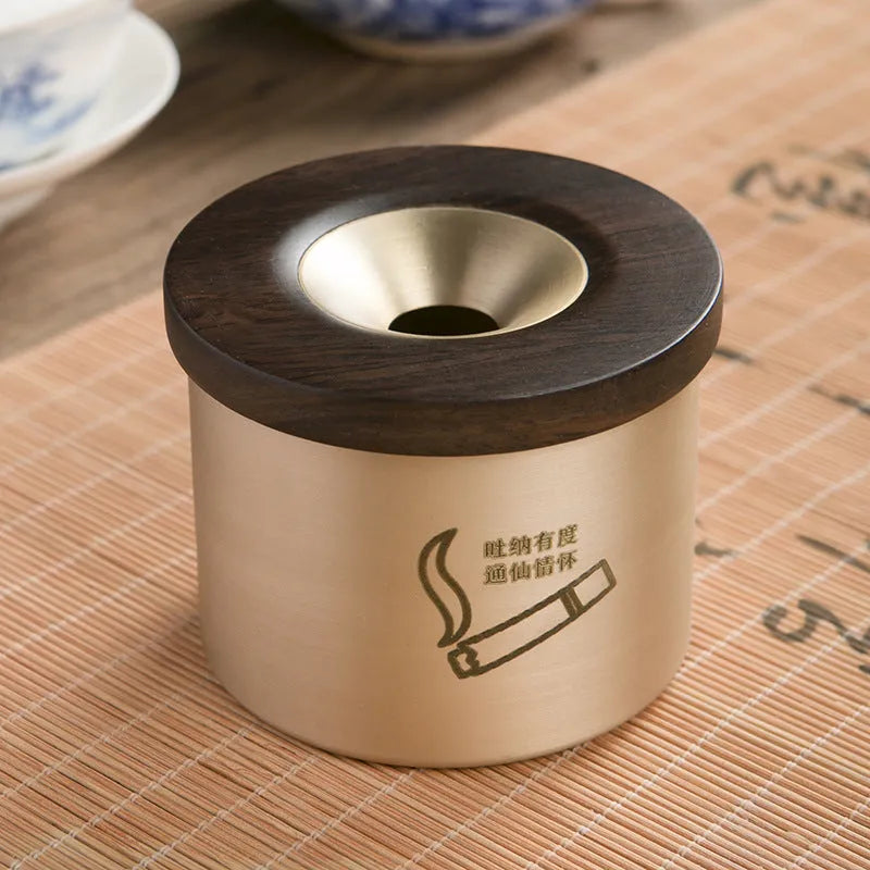 Copper retro ashtray with wooden lid showing central hole for ash collection