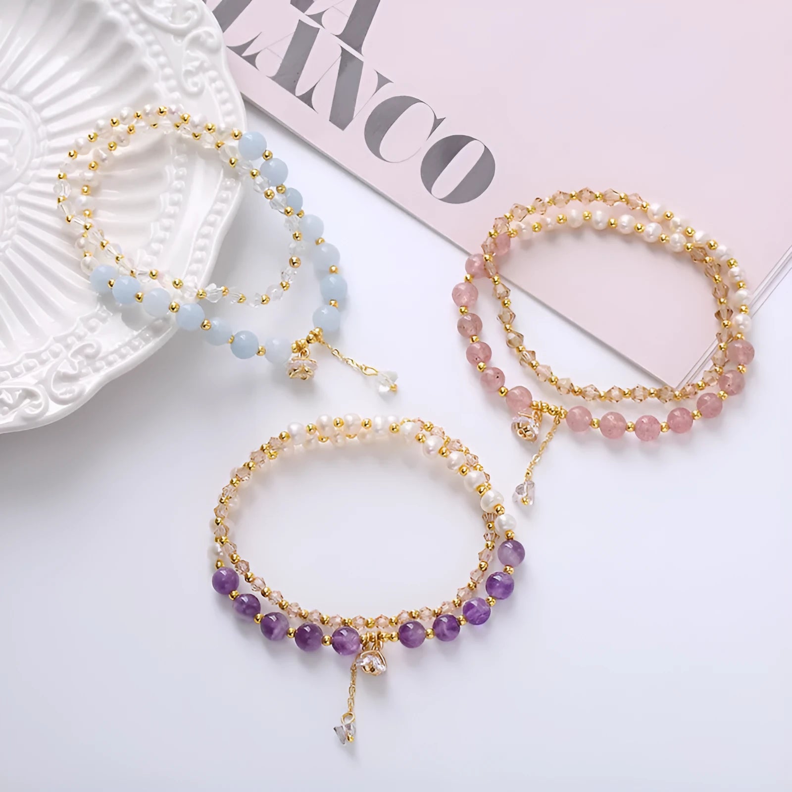 Handcrafted women's double ring crystal bracelet in amethyst, aquamarine, or strawberry quartz colour.