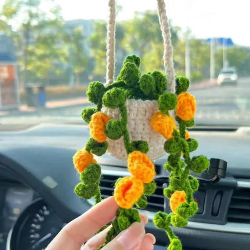 Green and white knitted wool plant ornament for car dashboard with hanging cord