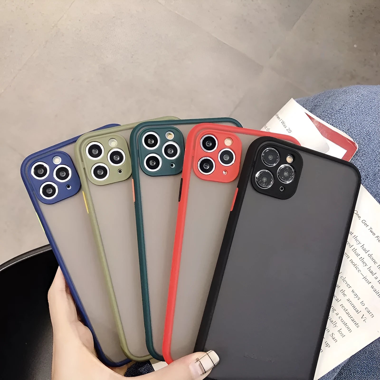 Solid colour hybrid shockproof protective case for iPhone models on a neutral background.