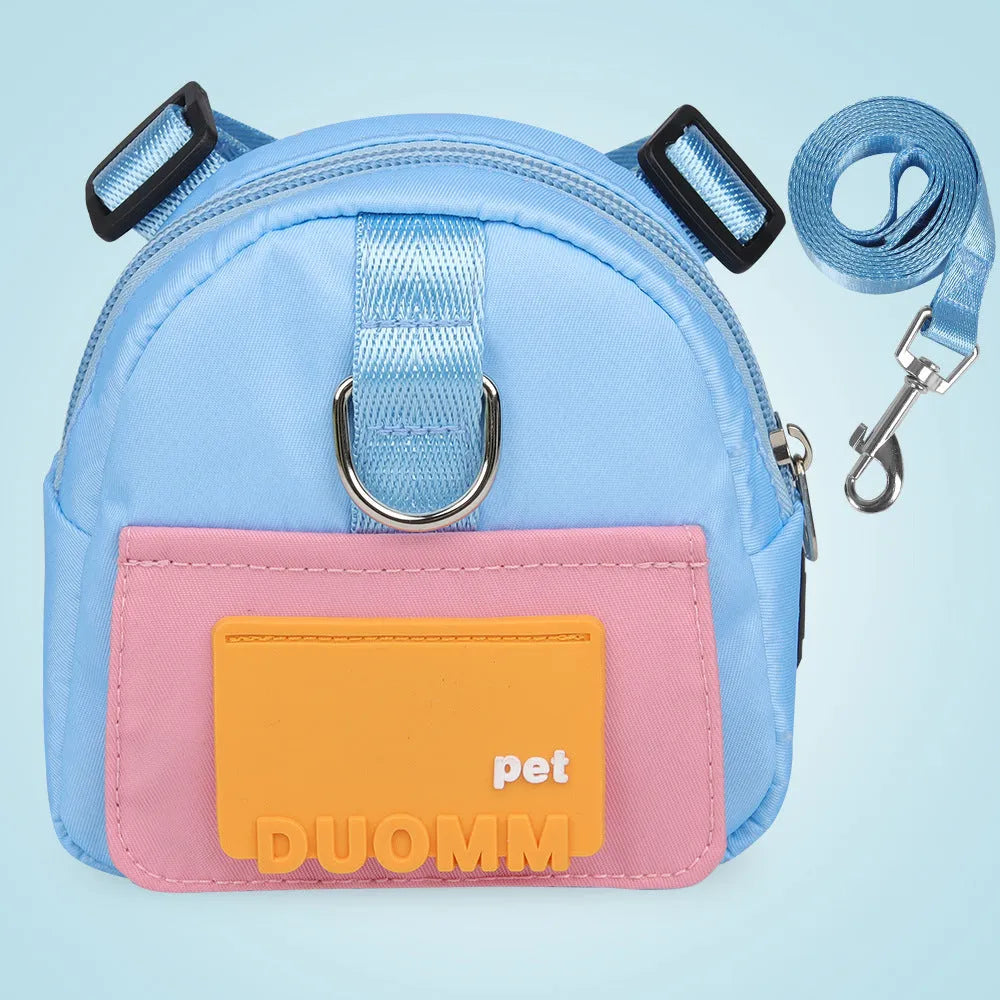 Blue adjustable dog harness backpack with breathable mesh panels and a tow rope attached.