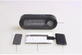 Black electronic car clock and thermometer on an adjustable bracket with luminous LED display.