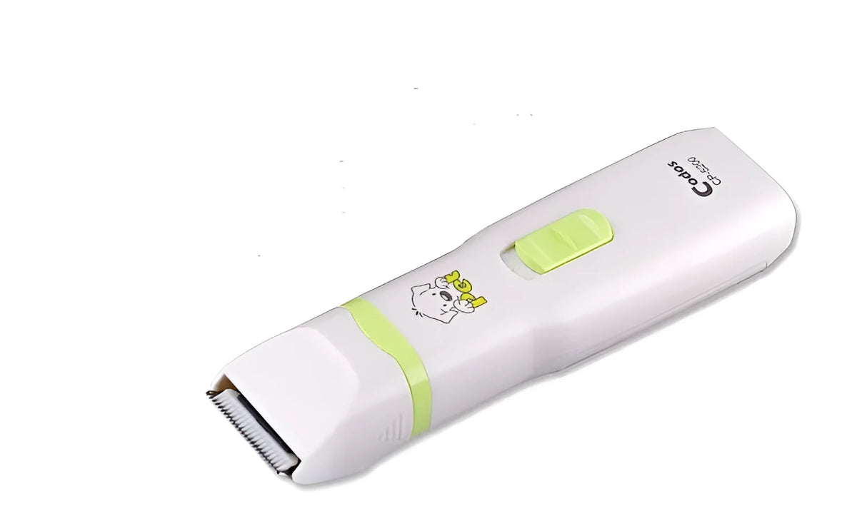 White pet grooming kit with electric hair trimmer, nail polisher, replacement head, lubricant, and small brush