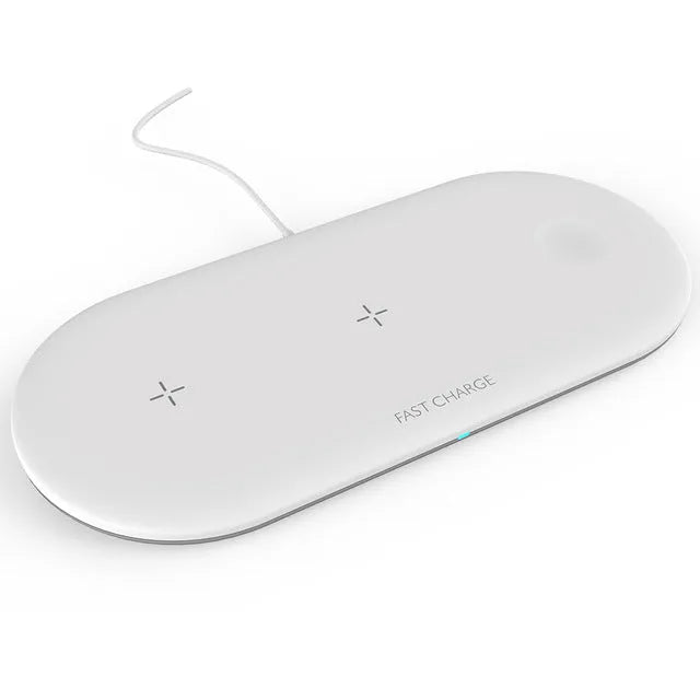 Black and white three-in-one wireless charging station for Apple iPhone, iWatch and headphones on a desk.
