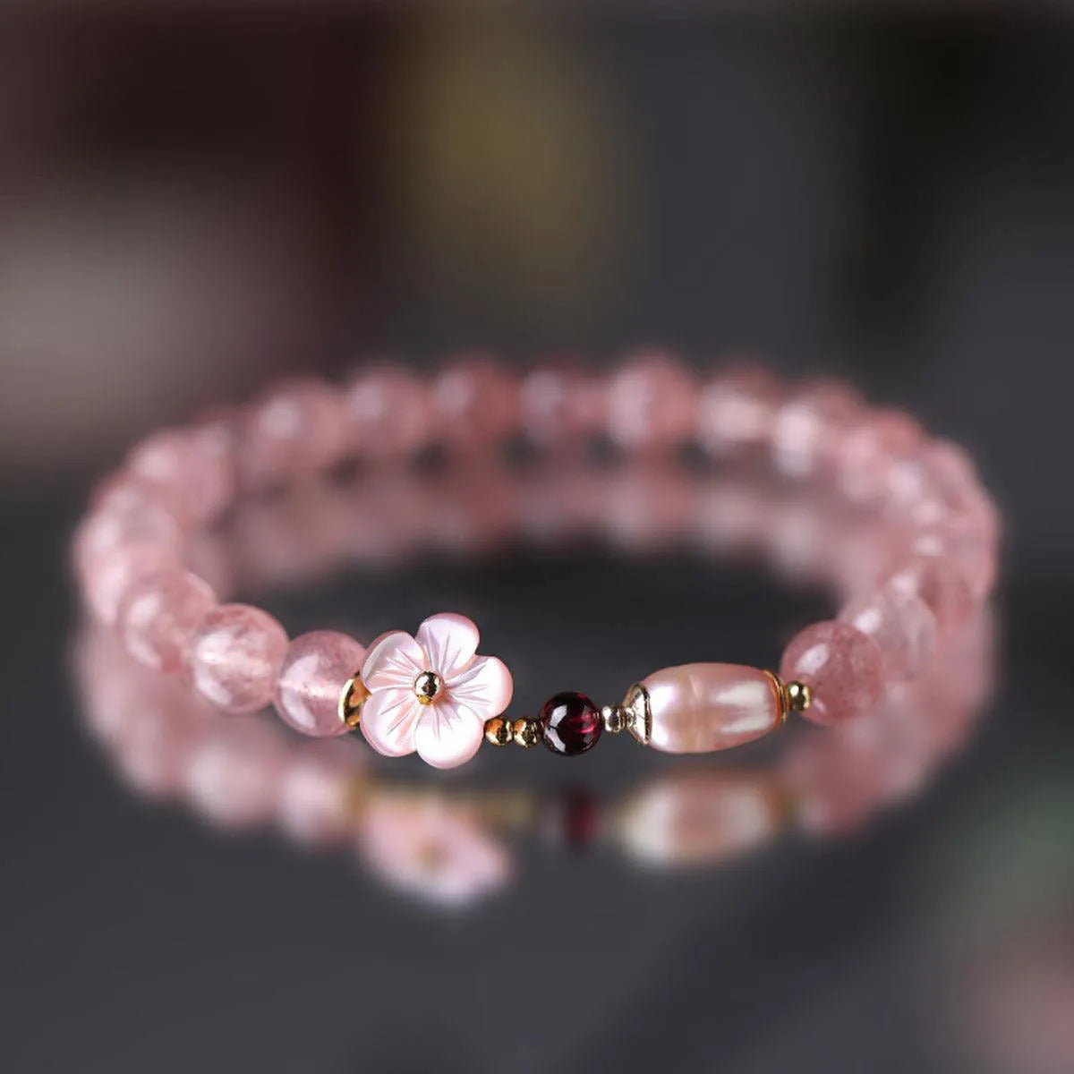 Strawberry quartz crystal bracelet with peach blossom flower charm design on adjustable chain