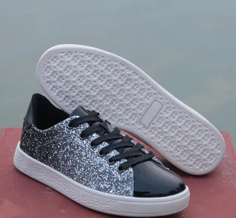 Women's black sequinned low-top lace-up shoes with a round toe and rubber sole
