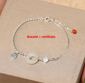 Silver bracelet with geometric peace buckle charm containing Hetian jade, traditional Chinese women's jewellery
