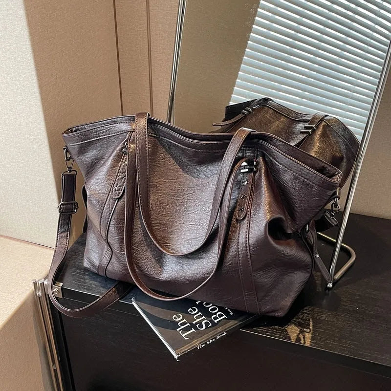 Retro soft PU leather messenger bag in black with horizontal square shape and sewing thread detail