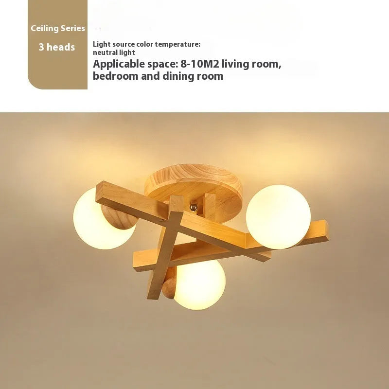 Wooden style modern Nordic ceiling light with three heads, installed in a living room.