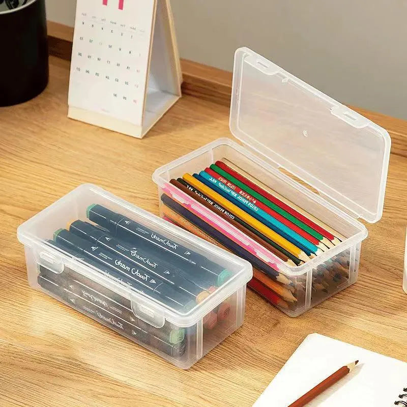 Clear plastic pencil storage box filled with colouring pencils and wax crayons.