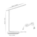White touch dimming colour-changing bedside lamp with USB charging cable.