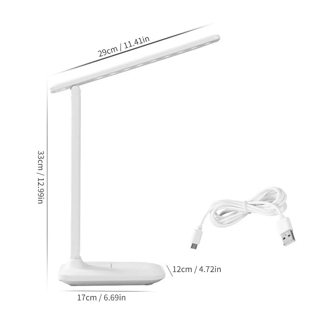 White touch dimming colour-changing bedside lamp with USB charging cable.