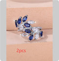 Adjustable copper leaf-shaped ring with a Horse Eye Zircon stone, shown in a rose gold finish.