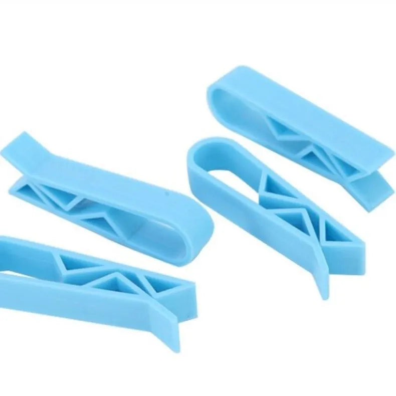 White PP plastic non-slip clip for fixing a bin liner to the side of a kitchen rubbish bin.