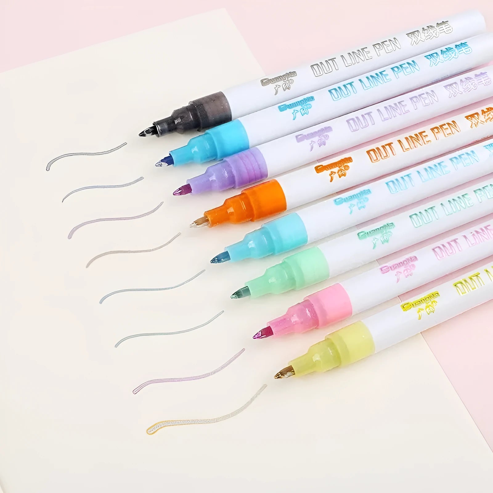 Set of highlighter pens with various colours, showcasing a plastic nib and 1mm-2mm line width on paper.