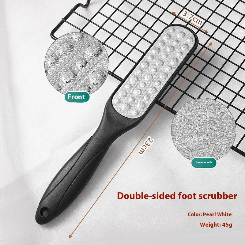 Stainless steel double-sided foot grinder tool with white and black abrasive units for manual foot care.