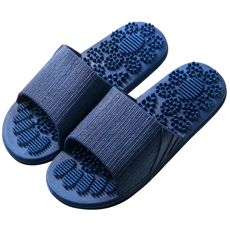 Pair of reflexology foot massage slippers with 3D acupressure particles, blue colour, on a light background
