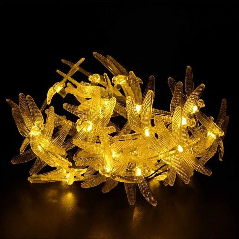 Outdoor solar-powered dragonfly string lights with 20 warm white LEDs on a 5 metre cable and IP65 waterproof rating
