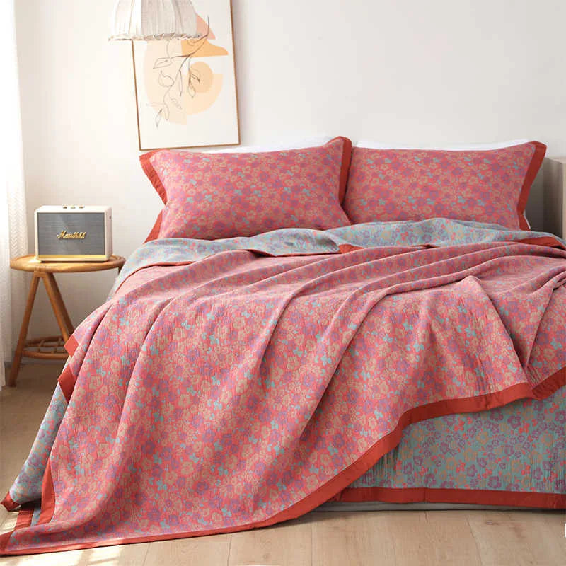 Cotton gauze bed blanket three-piece set with floral pattern showing blanket and two matching pillowcases