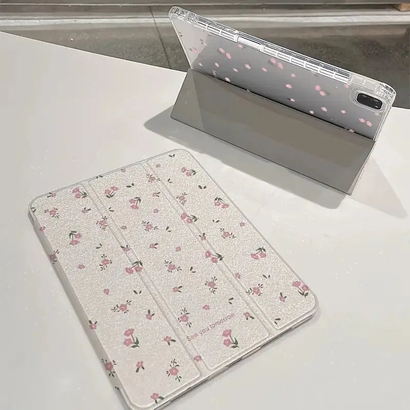 Transparent floral tri-fold protective case for Apple iPad tablet showing clear front and built-in stand