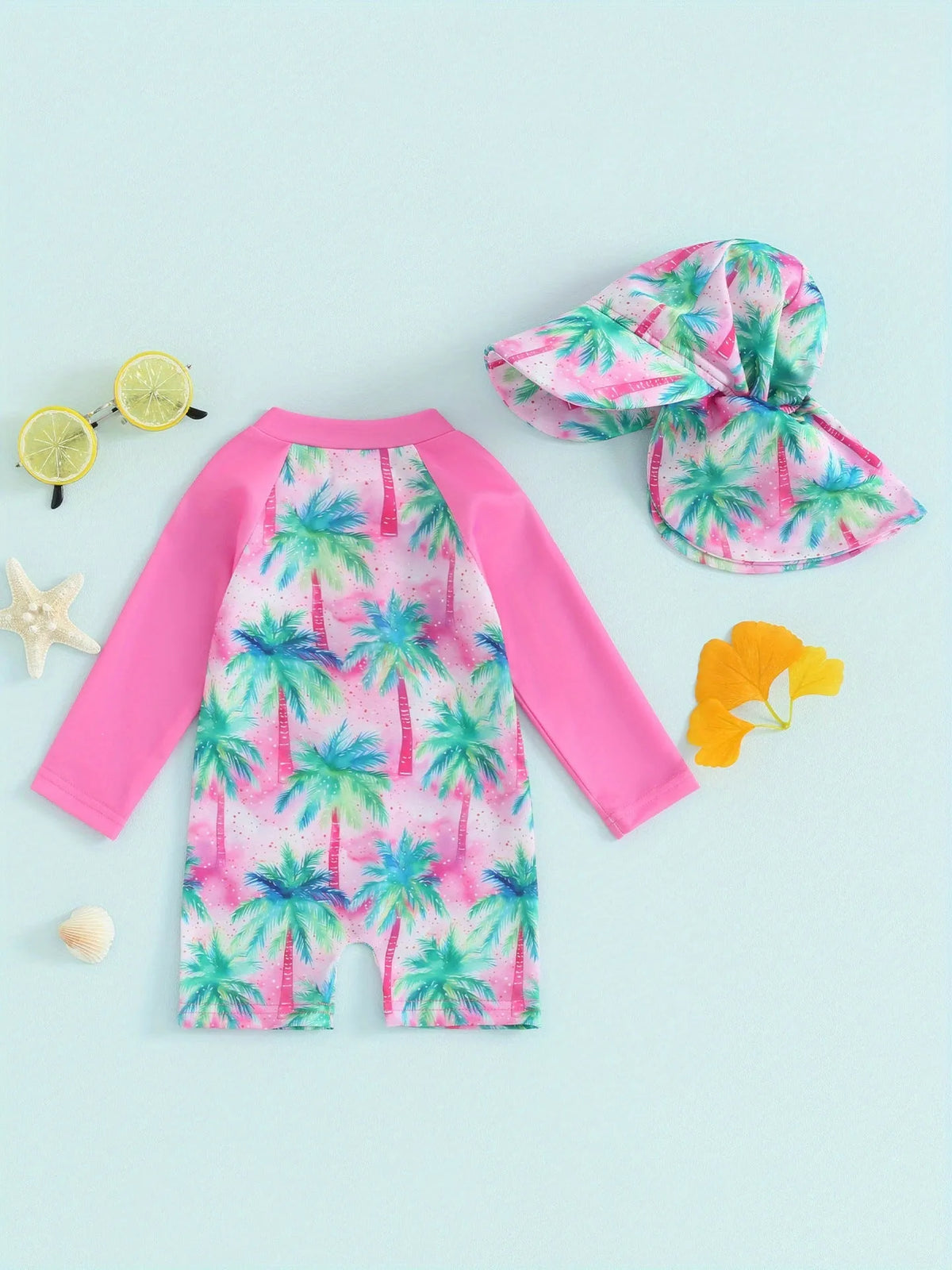 Green polypropylene fibre one-piece long-sleeve baby swimsuit with matching hat on neutral background