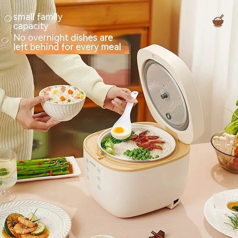 White or beige 3L rice cooker with black inner pot, rice scoop, measuring cup and steamer basket