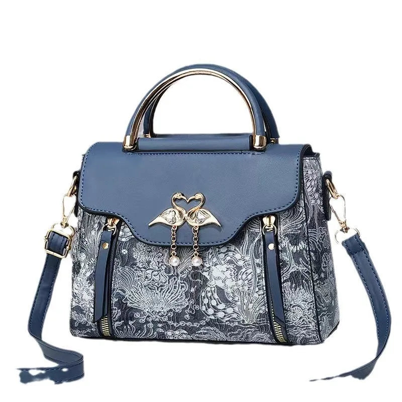 Women's PU crossbody bag in black with woven texture, horizontal square shape, and single shoulder strap