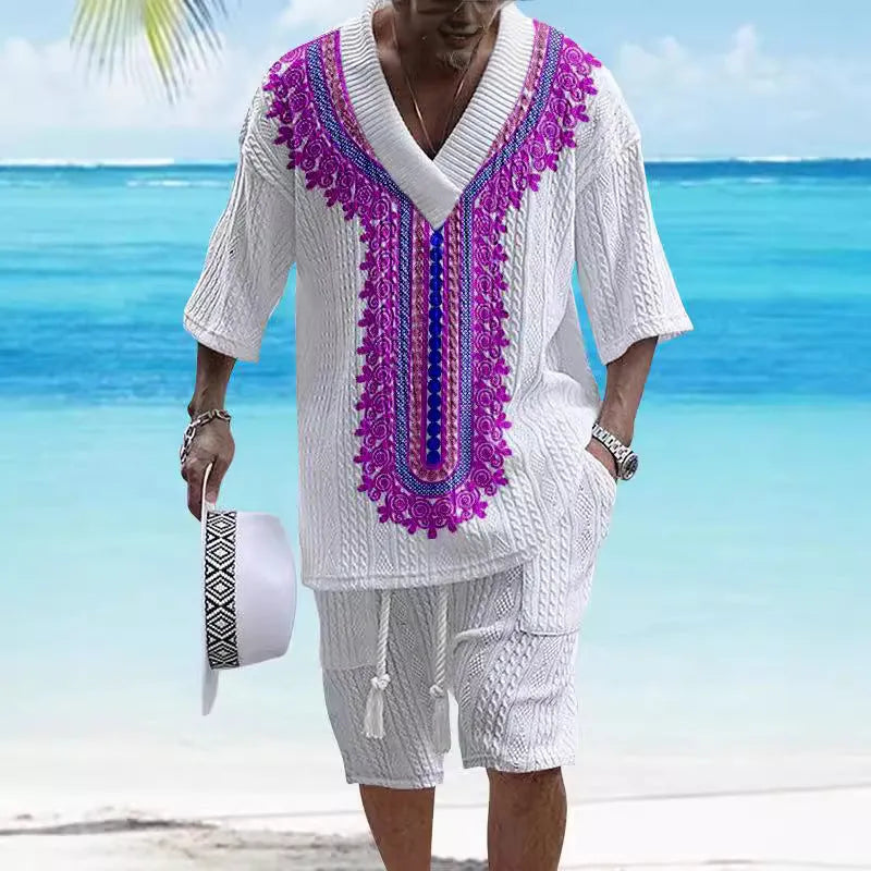 Man wearing a printed drop-shoulder knitted top and matching shorts from a casual summer suit.
