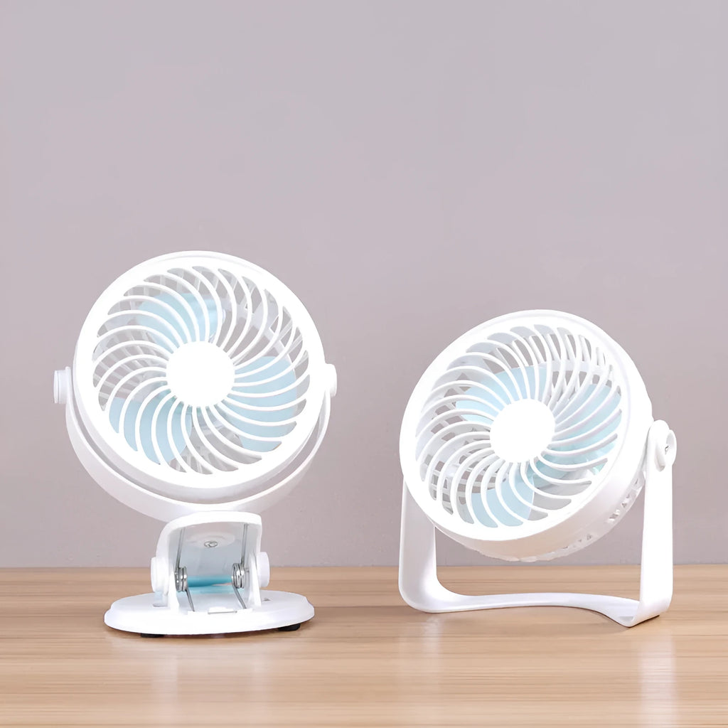 Mini USB desk fan with clip attachment and three blades, shown in desktop setting.