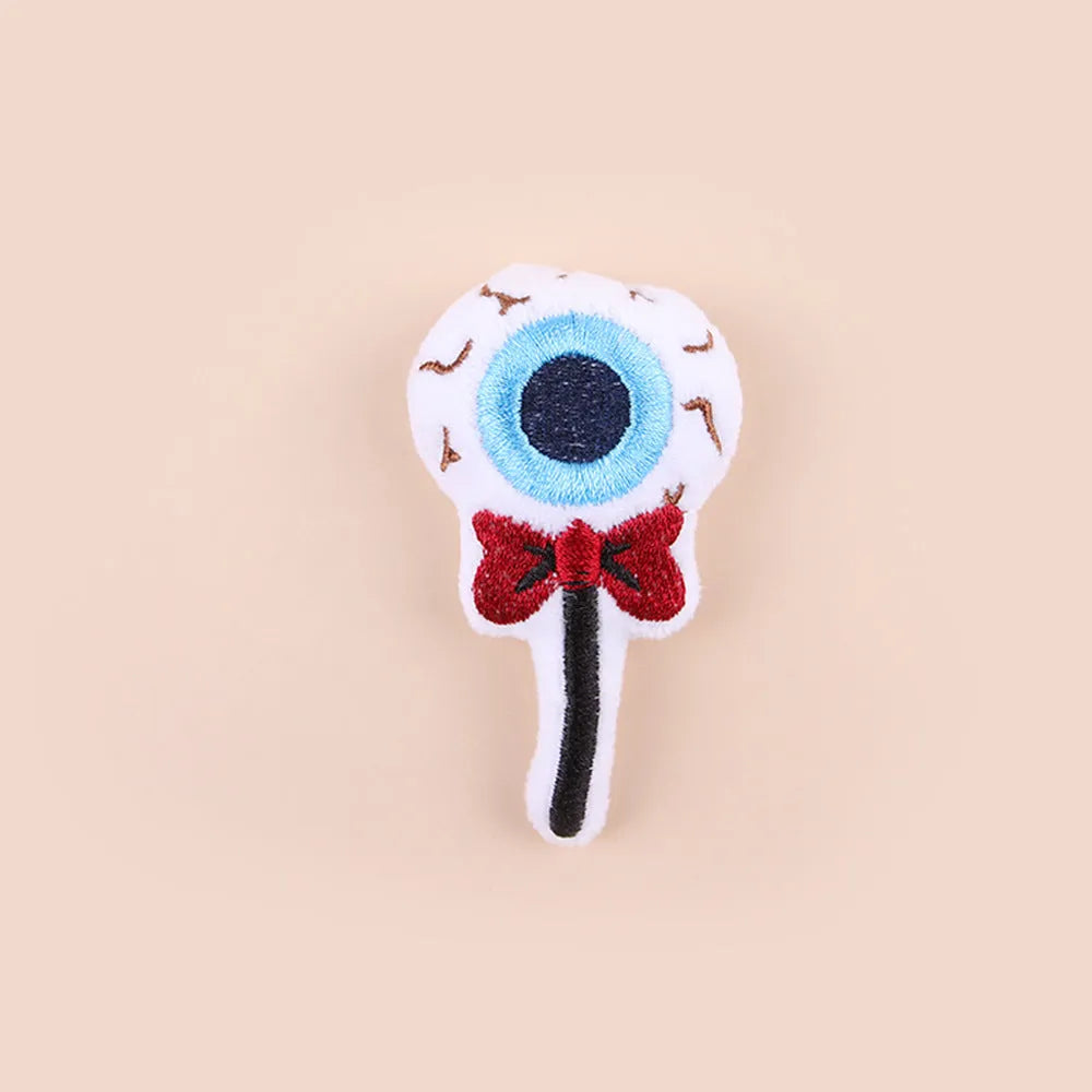 Small plush cat teaser wand toy with dangling elements in candy colour design