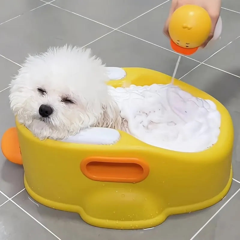 Blue duck-shaped PVC pet bath tub for washing dogs and cats on a floor.