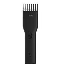 Black cordless electric hair clippers with ceramic blade and adjustable comb on a white background