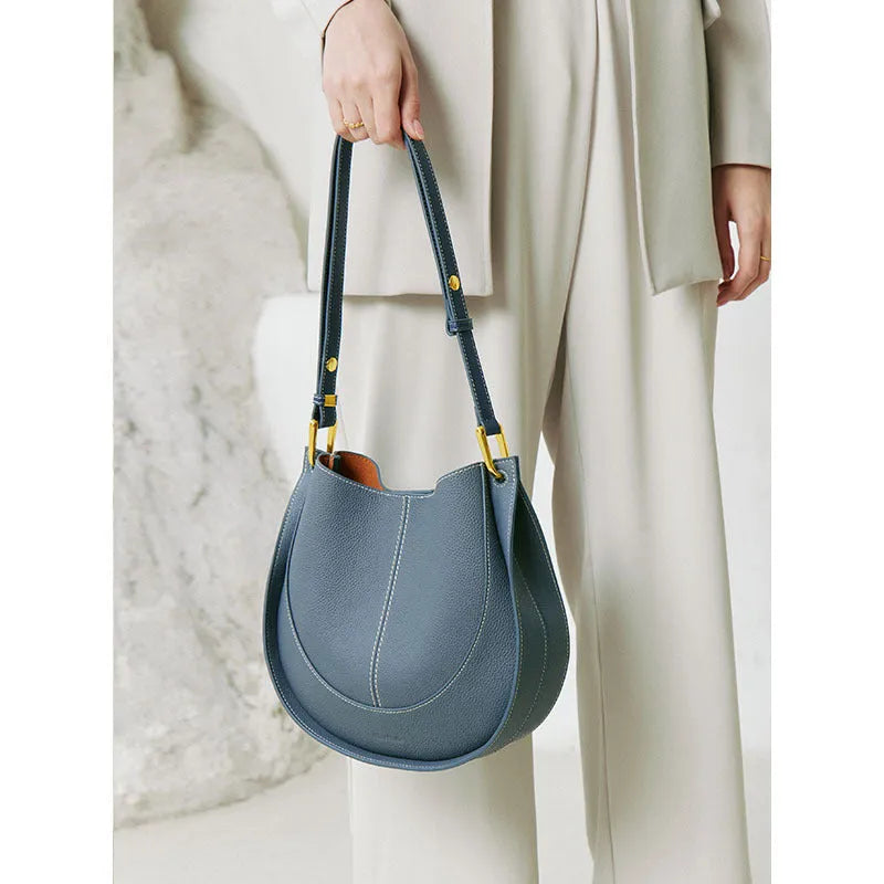 Designer small crossbody bag for women, genuine leather, round shape, retro splicing, milkshake white colour