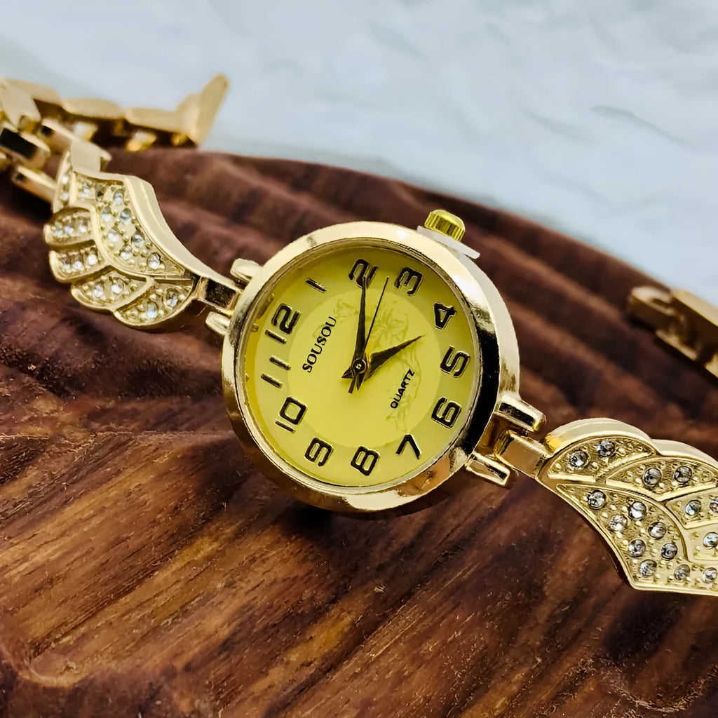 Stainless steel women's watch with round dial and Vachette clasp in gold, black and gold, or gold and white.