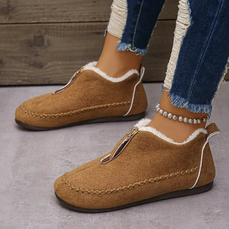 Women's suede retro low top boots in black showing low-top profile and rubber sole
