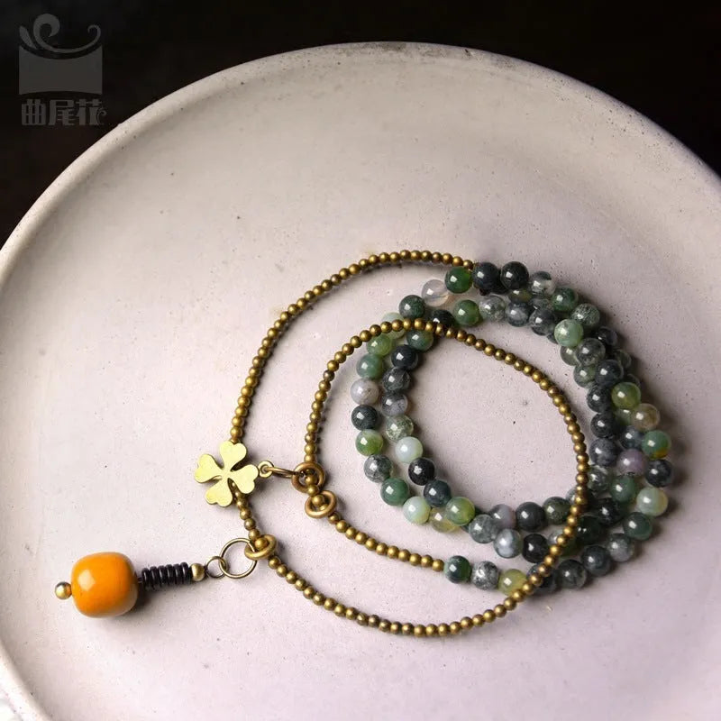 Handmade multi-layered ethnic style children's bracelet in natural crystal or stone, shown in sizes for boys and girls.