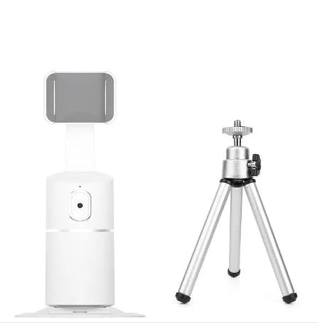 Black mini desktop camera tripod with extended legs and a U-shaped phone clip attached, on a white background.