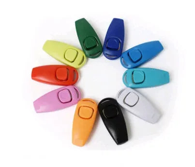 Plastic two-in-one dog training whistle ring in black on white background