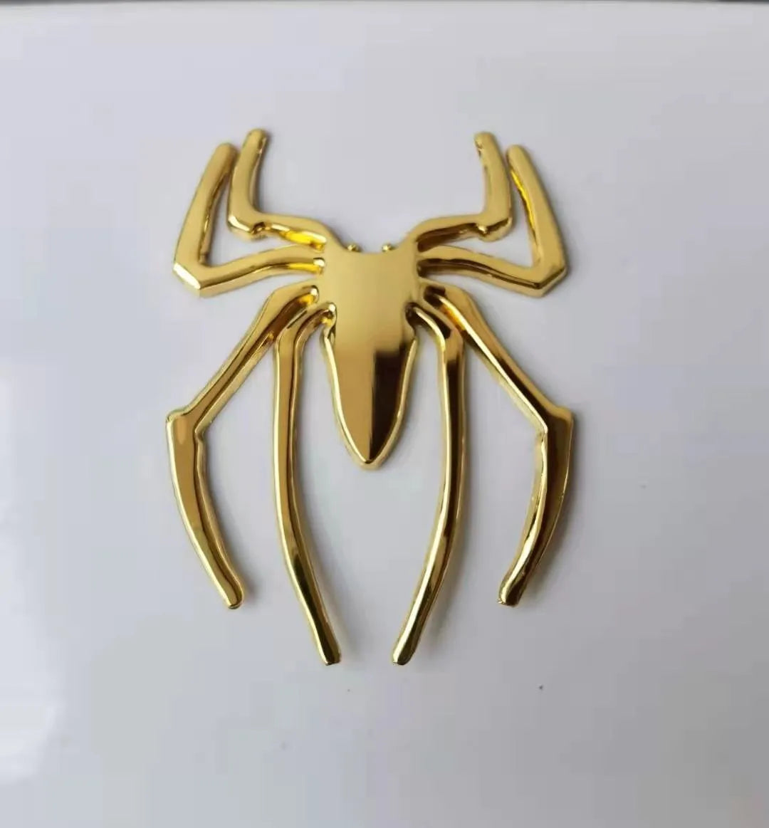 Three-dimensional metal spider car sticker in zinc alloy on a vehicle bumper.