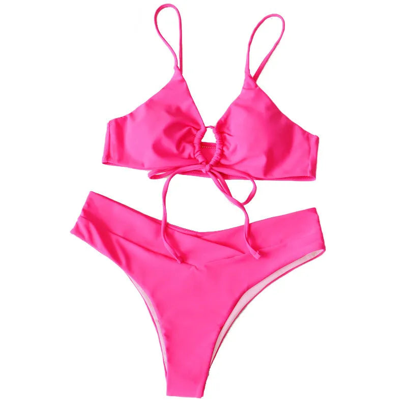 Women's orange tied bow bikini with halter neck top and high-cut briefs on mannequin