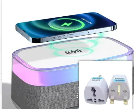 White multifunctional alarm clock with Bluetooth speaker and wireless charging pad on a table