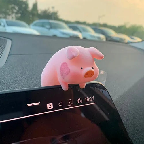 Set of eight cute cartoon pig resin car dashboard decorations on a car console