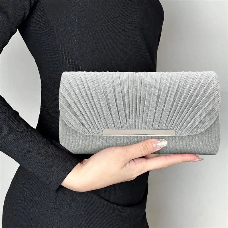 Women's hardware edge fine pink pattern PU clutch bag on a flat surface