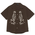 Brown striped men's short sleeve outdoor shirt with a Cuban collar on a hanger