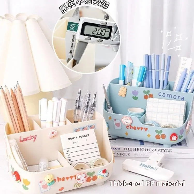 Plastic student desktop pencil case with 5 grid storage compartments, pens inside, in a milky white colour with stickers
