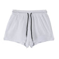 A pair of men's black quick-drying nylon shorts with a mid waist, laid flat.