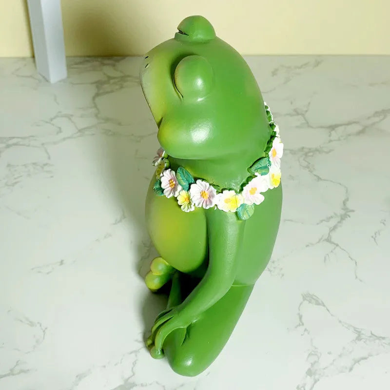 Magic yoga frog resin and plastic ornament in RDW123 colour on a shelf.