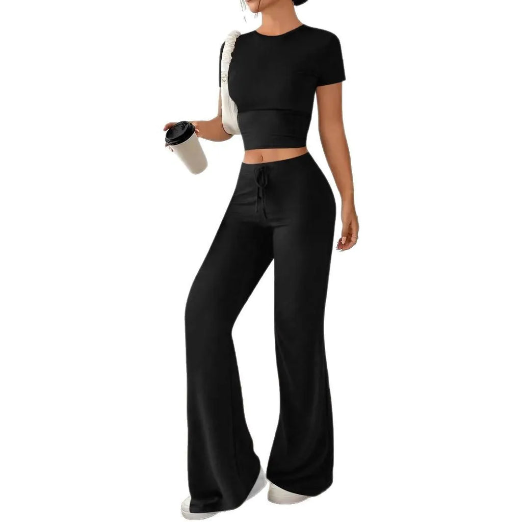Black high-waist trousers and regular-sleeve T-shirt matching set for women laid flat.